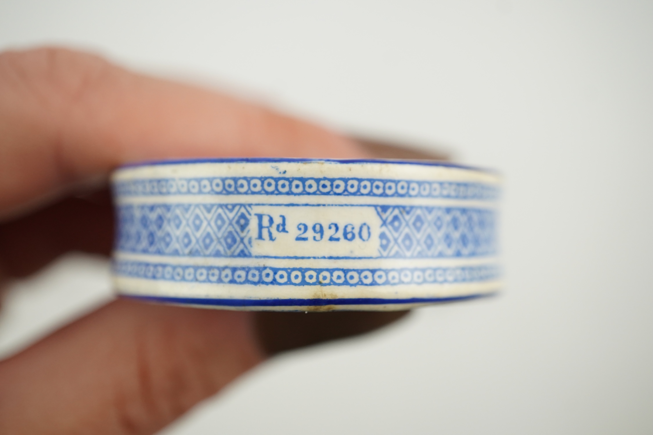 A Victorian white metal and enamel cylindrical scent bottle, 48mm (a.f.) and a late Victorian silver mounted willow pattern scent flask. Condition - poor to fair